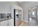 Bright kitchen with stainless steel appliances, modern cabinets, mosaic backsplash and grey countertop at 1425 Monte Lake Dr, Valrico, FL 33596