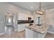 Modern kitchen boasts granite counters, stainless steel appliances, and an island with sink and counter seating at 1425 Monte Lake Dr, Valrico, FL 33596