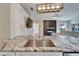Granite countertops, stainless sink and faucet highlight this modern kitchen with an open design concept at 1425 Monte Lake Dr, Valrico, FL 33596