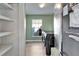 Bright laundry room with black washer and dryer, and window allowing lots of natural light to come through at 1425 Monte Lake Dr, Valrico, FL 33596