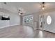 This airy living room features light wood flooring and vaulted ceilings with recessed lighting at 1425 Monte Lake Dr, Valrico, FL 33596