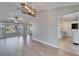 Bright, open living room features light wood flooring, updated lighting, and a large front window at 1425 Monte Lake Dr, Valrico, FL 33596