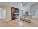 Bright living room featuring hardwood floors, modern fireplace and access to an outdoor pool at 1425 Monte Lake Dr, Valrico, FL 33596