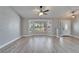Bright living room features light wood flooring and a large bay window offering plentiful natural light at 1425 Monte Lake Dr, Valrico, FL 33596