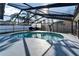 Backyard pool with screened-in enclosure, barbecue grill, and plenty of space for outdoor entertaining at 1425 Monte Lake Dr, Valrico, FL 33596