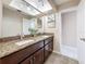 Double vanity bathroom featuring dark cabinets and granite countertops at 15 Tads Trl, Oldsmar, FL 34677