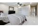 Comfortable bedroom features tile flooring, ceiling fan, and closet at 15 Tads Trl, Oldsmar, FL 34677