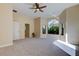 Inviting bedroom with carpet, ceiling fan, and a large window offering lots of natural light at 16307 Colwood Dr, Odessa, FL 33556