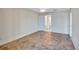 Bedroom with stylish tile flooring, ceiling fan, closet and ensuite bathroom at 19029 Us Highway 19 N # 17A, Clearwater, FL 33764