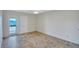 Bedroom featuring stylish tile flooring, ceiling fan, closet and sliding glass door to lanai with water views at 19029 Us Highway 19 N # 17A, Clearwater, FL 33764