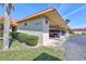 Community carport with lush landscaping, offering convenient covered parking at 19029 Us Highway 19 N # 17A, Clearwater, FL 33764
