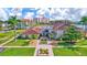 Well-manicured grounds lead to a welcoming clubhouse entrance surrounded by lush landscaping and vibrant community buildings at 19029 Us Highway 19 N # 17A, Clearwater, FL 33764