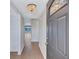 Bright entryway features wood-look tile flooring, stylish chandelier, and views to the water at 19029 Us Highway 19 N # 17A, Clearwater, FL 33764