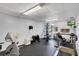 Well-equipped gym featuring a treadmill, stationary bike, weight machines, and other fitness equipment at 19029 Us Highway 19 N # 17A, Clearwater, FL 33764