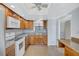 Kitchen with stainless steel appliances, tile backsplash, and white and wood cabinetry at 19029 Us Highway 19 N # 17A, Clearwater, FL 33764