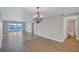 Open floorplan living room with views of the lake and bathroom access at 19029 Us Highway 19 N # 17A, Clearwater, FL 33764