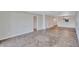 Open floorplan featuring neutral walls, base trim, and tile/laminate flooring throughout at 19029 Us Highway 19 N # 17A, Clearwater, FL 33764