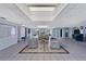 Bright, airy lobby with comfortable seating and a skylight, perfect for relaxing or socializing with neighbors and guests at 19029 Us Highway 19 N # 17A, Clearwater, FL 33764