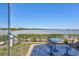Scenic patio view overlooking the serene water with outdoor seating at 19029 Us Highway 19 N # 17A, Clearwater, FL 33764