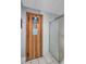Inviting sauna room with wooden door and adjacent shower area for relaxation and wellness at 19029 Us Highway 19 N # 17A, Clearwater, FL 33764