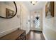 Welcoming home entryway with an ornate glass front door and hardwood floors at 19941 Gulf Blvd # 105, Indian Rocks Beach, FL 33785