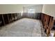 Bedroom featuring exposed studs and the outline of previous carpet placement at 200 Country Club Dr # 1001, Largo, FL 33771