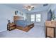 Comfortable main bedroom showcasing natural wood furniture, neutral tones, and a well-lit interior at 22167 Tucana Way, Land O Lakes, FL 34637