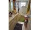 Bathroom featuring a double vanity and tiled shower at 2510 Cypress Bend E Dr, Clearwater, FL 33761