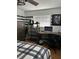 Bedroom featuring a desk, shelves, and black and white stripped walls at 2510 Cypress Bend E Dr, Clearwater, FL 33761