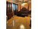 Ornate main bedroom featuring hardwood floors, detailed wardrobe, and four-poster bed at 2510 Cypress Bend E Dr, Clearwater, FL 33761
