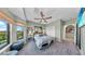 Comfortable bedroom with calming decor, plush carpet, and ample natural light at 2773 Via Cipriani # 1330B, Clearwater, FL 33764