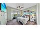 Cozy bedroom featuring a large bay window with natural light and serene decor at 2773 Via Cipriani # 1330B, Clearwater, FL 33764