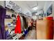 Organized walk-in closet featuring shelving, hanging rods, and overhead storage at 2773 Via Cipriani # 1330B, Clearwater, FL 33764