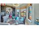 Bright dining room features a glass table, wine rack and beautiful views at 2773 Via Cipriani # 1330B, Clearwater, FL 33764