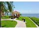 Scenic gazebo with brick pathway, perfect for relaxing with waterfront views and nearby grills at 2773 Via Cipriani # 1330B, Clearwater, FL 33764