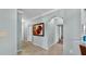 Hallway with archway, tile flooring, and white trim at 2773 Via Cipriani # 1330B, Clearwater, FL 33764