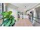 Modern kitchen with stainless steel appliances flowing into the living area with large windows for plenty of sunlight at 2773 Via Cipriani # 1330B, Clearwater, FL 33764