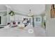 Stylish kitchen with white cabinets, stainless steel appliances, quartz countertops and a tiled floor at 2773 Via Cipriani # 1330B, Clearwater, FL 33764