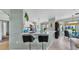 Kitchen with quartz countertops and barstool seating overlooking the dining area at 2773 Via Cipriani # 1330B, Clearwater, FL 33764