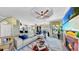 Comfortable living room with fireplace, open floorplan, ceiling fan and large windows at 2773 Via Cipriani # 1330B, Clearwater, FL 33764