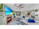 Bright and inviting living room featuring a cozy fireplace and a plush sofa with tasteful decor at 2773 Via Cipriani # 1330B, Clearwater, FL 33764