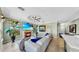 Bright living room with a fireplace, large windows, and comfortable seating at 2773 Via Cipriani # 1330B, Clearwater, FL 33764