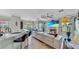 Spacious living room with a fireplace, open floorplan and views to kitchen at 2773 Via Cipriani # 1330B, Clearwater, FL 33764