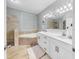 Bright main bathroom with double vanity, soaking tub and walk-in shower at 2773 Via Cipriani # 1330B, Clearwater, FL 33764