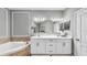 Elegant main bathroom with double sink vanity, soaking tub and great lighting at 2773 Via Cipriani # 1330B, Clearwater, FL 33764