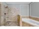 Spa shower features glass enclosure, multiple sprayers and pebble floor at 2773 Via Cipriani # 1330B, Clearwater, FL 33764