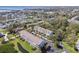Neighborhood aerial view featuring townhomes, green spaces, and the surrounding community at 31 Estuary Trl, Clearwater, FL 33759