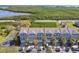 View of the townhomes showcasing the lake and nature preserve in the community at 31 Estuary Trl, Clearwater, FL 33759