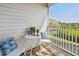 Charming balcony features cozy seating, ideal for relaxing and enjoying the scenic views at 31 Estuary Trl, Clearwater, FL 33759