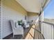 Spacious screened balcony provides a relaxing outdoor space with comfortable wicker seating and peaceful views at 31 Estuary Trl, Clearwater, FL 33759